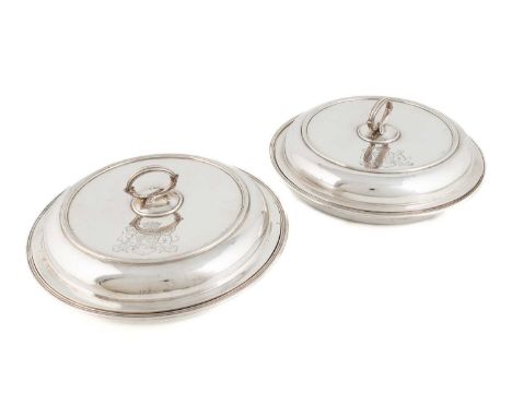 A pair of George IV silver vegetable dishes and covers, by Robert Garrard, London 1827, circular form, reeded borders, detach