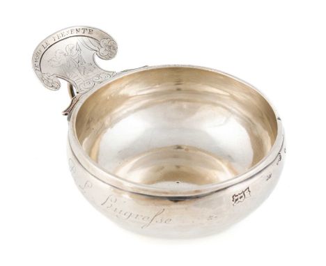 A Louis XV French provincial silver wine taster, maker's mark I.R over I, unidentified, Rouen 1753, circular form, the shaped