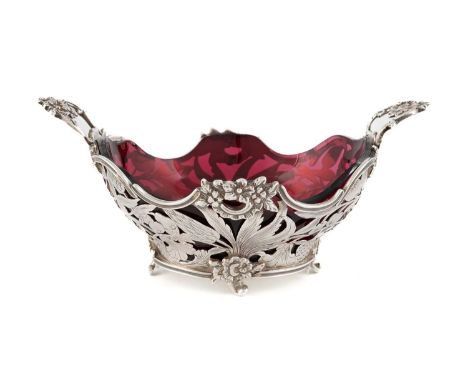 A Dutch silver basket,oval form, pierced foliate scroll decoration, foliate handles, with a red glass liner, length 19cm, app