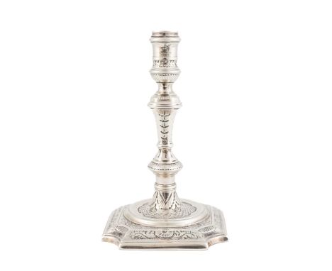 A George II silver taperstick,by Matthew Cooper, London probably 1729,tapering and knopped form, with foliate and fish scale 