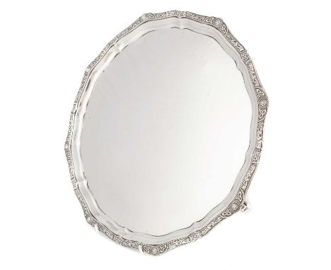 A modern silver salver,by Goldsmiths &amp; Silversmiths Co Ltd, Birmingham 1952, circular form with a Celtic motif decorated 