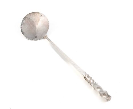 By Stuart Jenkins, a large modern silver serving spoon, London 2010, faceted stem with a twisting finial, circular form, spot