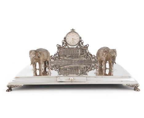 An Indian silver inkstand,unmarked, by Hamilton &amp; Co., Calcutta 1929,rectangular form, the back with an embossed scene of