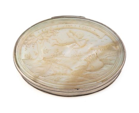 An early-18th century silver-mounted mother-of-pearl snuff box, unmarked, circa 1720, oval form, the hinged cover carved with