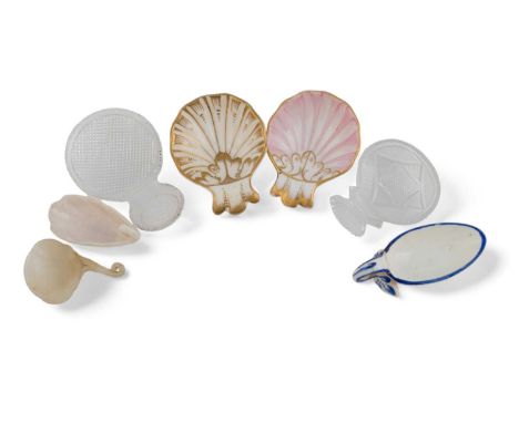 A collection of seven various caddy spoons, comprising: two cut-glass examples, four porcelain ones and a hardstone caddy spo