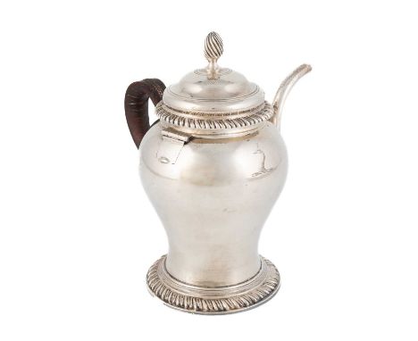A George III silver argyle,maker's mark worn, London 1769,baluster form, leather-bound scroll handle, gadroon borders, the pu