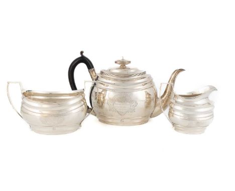 A three-piece George III presentation silver tea set, by Samuel Hennell, London 1801, oval form, reeded borders, scroll handl