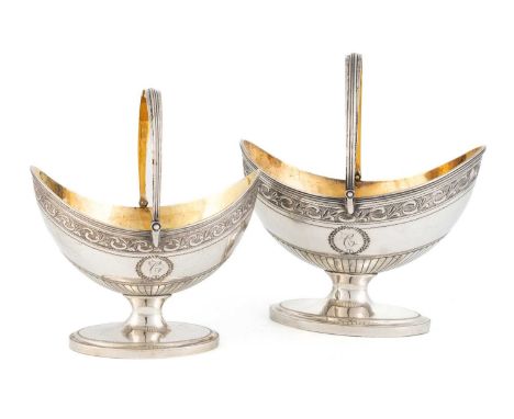 A George III silver swing-handled sugar basket and cream basin, by Urquhart and Hart, London 1796, oval form, with a border o