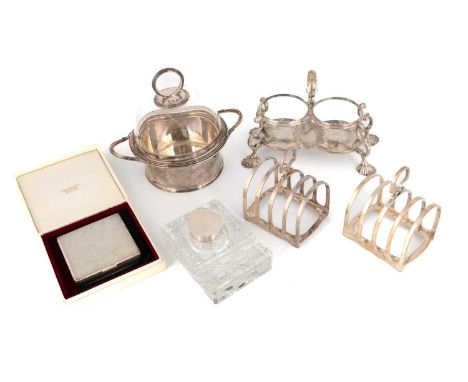 A mixed lot of silver items,comprising: a George II oil and vinegar bottle stand, scroll handle, on four shell feet, by Samue