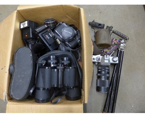 A collection of cameras including Praktica Pentax, Emi K.35, two pairs of binoculars and a tripod **PLEASE NOTE THIS LOT IS N