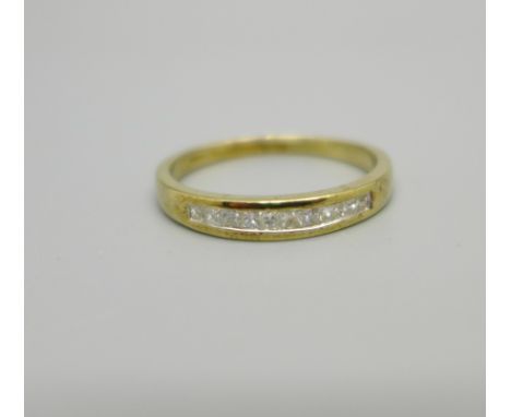 A 9ct gold ring set with ten princess cut diamonds, 2g, P 