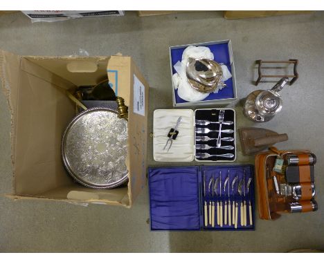 A collection of plated flatware and other plated and metalware including a teapot and brass candlestick holder **PLEASE NOTE 