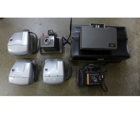 Six Polaroid cameras 