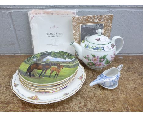 A Royal Worcester teapot decorated with flowers and butterflies, five Royal Albert collectors plates with certificates, and a