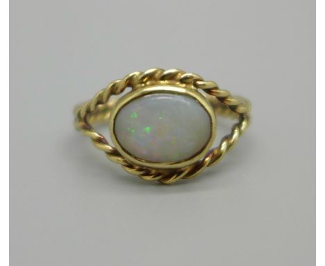 A 9ct gold and opal ring, 2.1g, K, opal approximately 8mm x 6mm 