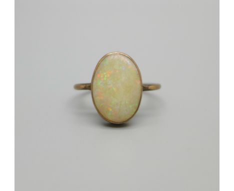 A 9ct gold and opal ring, 1.7g, K, opal approximately 9mm x 13mm and scratched 