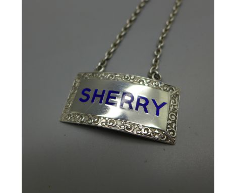 A silver and enamel sherry label, Birmingham 1964 
