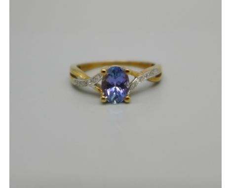 A 9ct gold ring set with tanzanite and diamond shoulders, 2g, O 