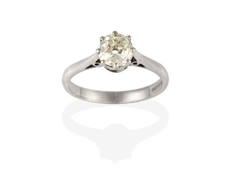 An 18 Carat White Gold Diamond Solitaire Ring, the old cut diamond in a claw setting, to a tapered shoulder plain polished sh