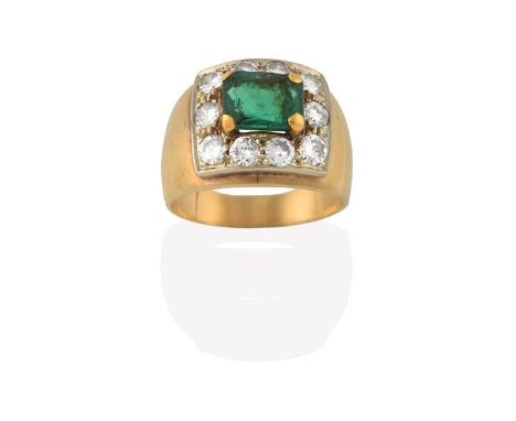 An Emerald and Diamond Cluster Ring, the emerald-cut emerald within a border of round brilliant cut diamonds, in yellow claw 