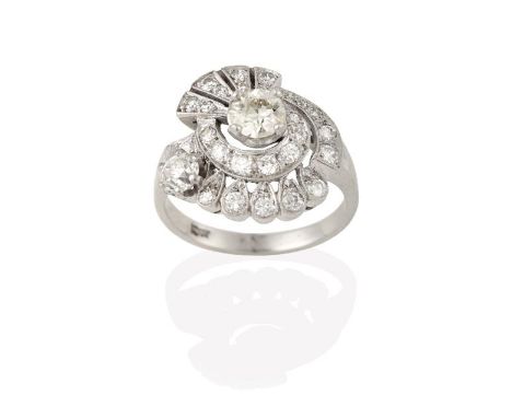 A Diamond Cluster Ring, realistically modelled as a shell motif, set throughout with round brilliant cut, old cut and eight-c