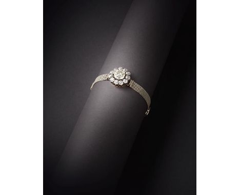 A Diamond Cluster Bracelet, the old cut diamond within a border of eleven smaller old cut diamonds, in white claw settings, o