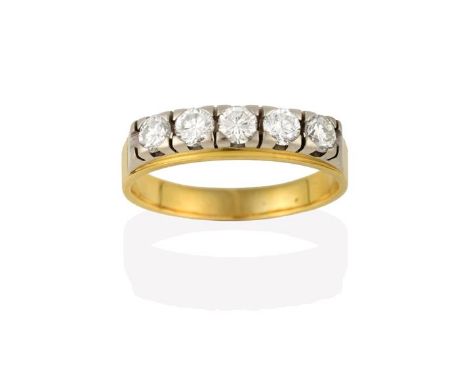 A Diamond Five Stone Ring, the round brilliant cut diamonds in white claw settings, to a yellow tapered shoulder plain polish