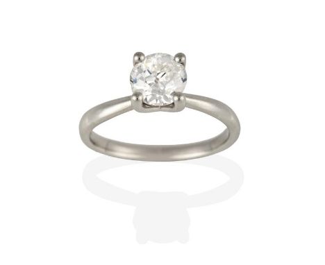 A Platinum Diamond Solitaire Ring, the round brilliant cut diamond in a four claw setting, to a tapered shoulder plain polish