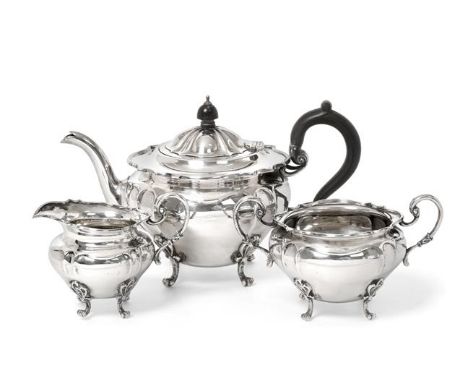 A Three-Piece Edward VII Scottish Silver Tea-Service, by Hamilton and Inches, Edinburgh, 1908, each piece tapering and on fou