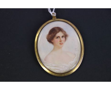 An early 20th century miniature portrait of a young lady signed with initials AN and dated 1914.
