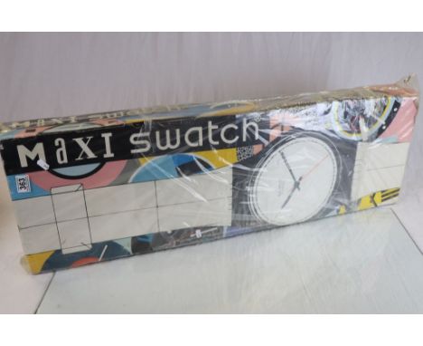 Maxi Swatch display watch and original box.   Opened once by owner to test working order