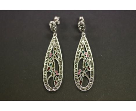 A pair of silver marcasite and ruby earrings