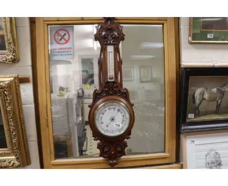 Late 19th / Early 20th century Aneroid Barometer and Thermometer held within an Art Nouveau Heavily Carved Oak Case