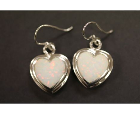 A pair of silver and opal heart shaped earrings