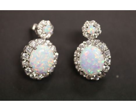 A pair of large silver CZ and opal earrings 