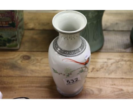 An oriental Chinese republic ceramic vase with bird and floral decoration signed to main body.