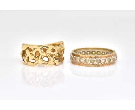 TWO 9CT GOLD RINGS  (2)Comprising; a ring with cast and pierced decoration, ring size M and a colourless gem set full eternit