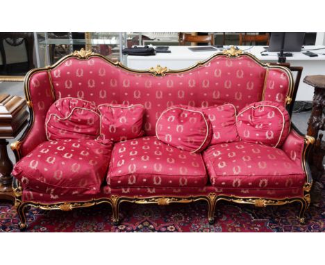 A LOUIS XIV STYLE PARCEL GILT EBONISED SOFA190cm wide; 105cm high