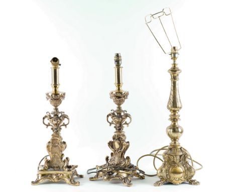 A PAIR OF BRASS TABLE LAMPS TOGETHER WITH ANOTHER SINGLE LAMP BASE (3)The single with acanthus leaf column and tripod paw fee