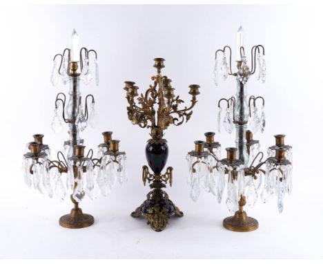 A 19TH CENTURY GILT-BRASS AND RED GLAZED CERAMIC SIX LIGHT CANDELABRA (3)51 cm high, together with a paiir of gilt-metal and 