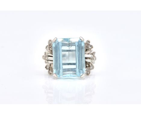 A WHITE GOLD, AQUAMARINE AND DIAMOND RINGClaw set with the cut cornered rectangular step cut aquamarine, between baguette and