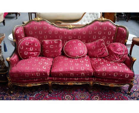 A LOUIS XIV STYLE PARCEL GILT EBONISED SOFA190cm wide; 105cm high