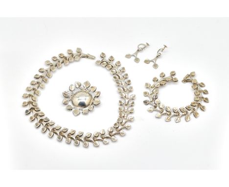 A SILVER FOUR PIECE JEWELLERY SUITE (4)Comprising; a collar necklace, length 37cm, a bracelet, length 19cm, a brooch and a pa