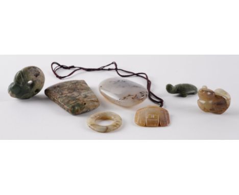 A GROUP OF SEVEN JADE HARDSTONE CARVINGSComprising; a jade zhulong ( pig dragon), 5cm high; a jade pendant carved with a pig,