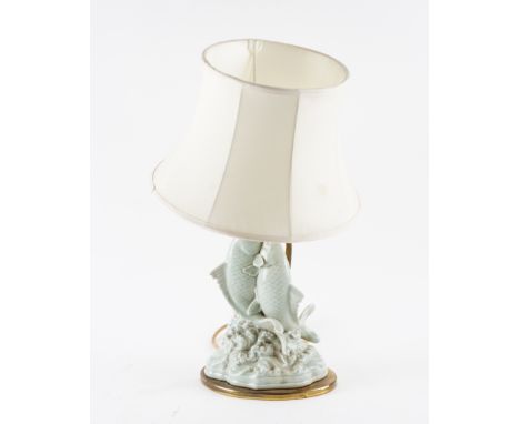 A CELADON PORCELAIN FISH LAMP AND SHADEOn gilt metal base, fish 25cm high
