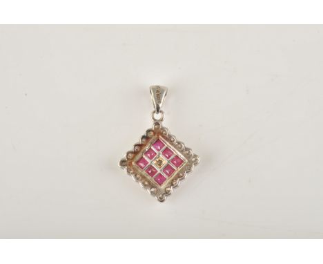 AN 18CT WHITE GOLD, RUBY AND DIAMOND SQUARE PENDANTMounted with a circular cut diamond at the centre, in a surround of eight 