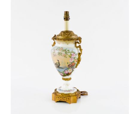 A FRENCH GILT-METAL MOUNTED PARIS PORCELAIN WHITE GROUND TABLE LAMPLate 19th / Early 20th Century 
Painted with a water bird 