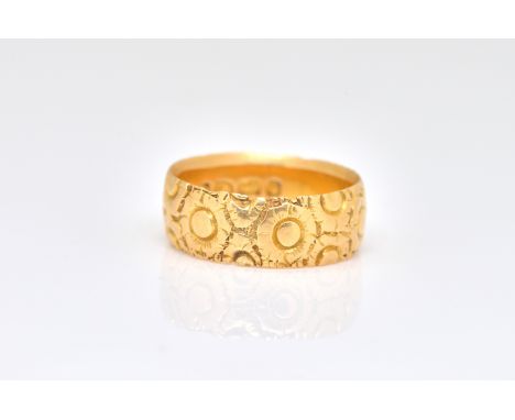 A VICTORIAN 18CT GOLD BAND RINGHaving floral decoration, Birmingham 1890, ring size M, weight 5 gms