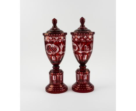A PAIR OF BOHEMIAN FLASH-RUBY GLASS URNS AND COVERS (2)Late 19th Century 
40cm highCondition Report:Generally fine with minor