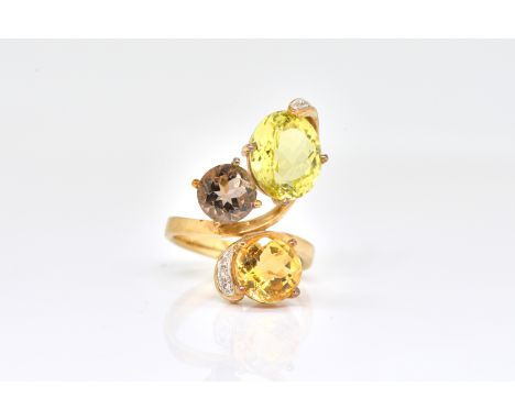 A 9 CT GOLD, CITRINE AND SMOKY QUARTZ RINGIn a trefoil shaped design, having a diamond set stem, ring size P, gross weight 6.